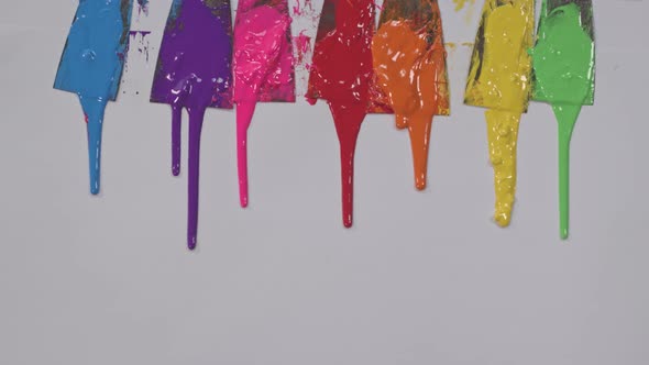 Colorful Dripping On White Paper. alt