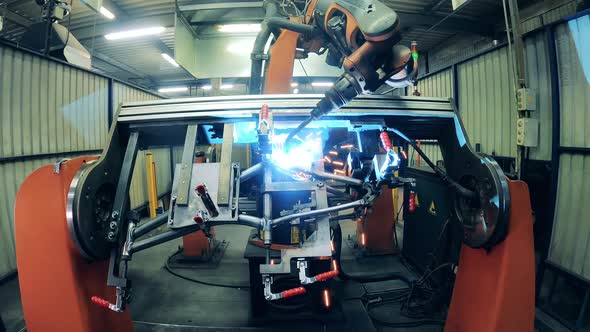 Robotic Arm Precisely Welding Bike Frame at a Bicycle Plant alt