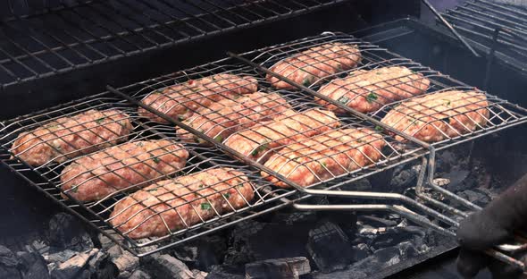 Mixed American Barbecue Food on a Hot Grill with Burgers and Beef Roasts alt