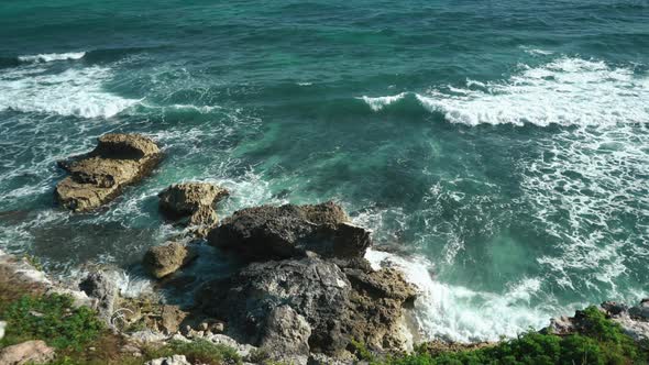 Breaking Sea Waves and Rocks in Isla Mujeres Mexico