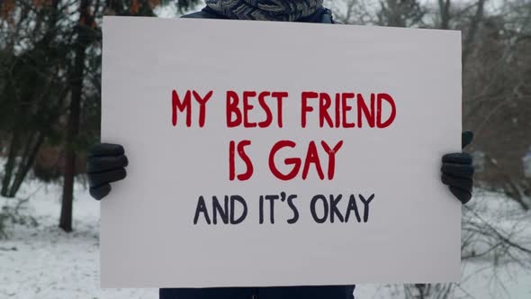 Protesting with a Lgbt solidarity poster My Best Friend Is Gay And Its Okay alt