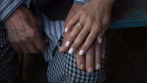 Close-up of Three Hands of Different Ages From Old Man To Child alt