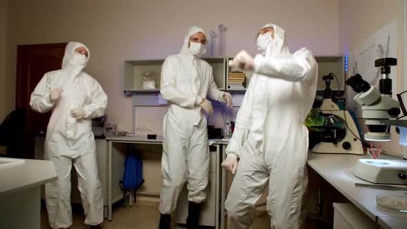 Youngs Scientists Dancing in Laboratory