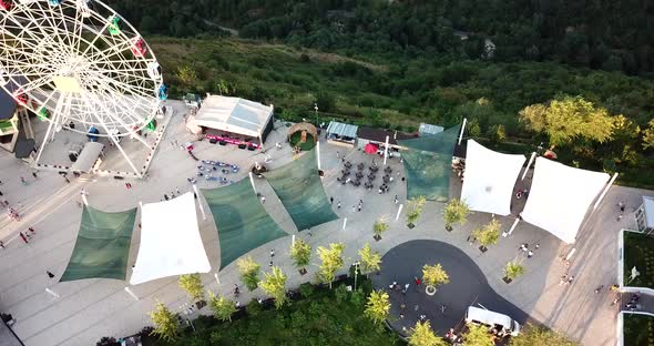Ferris Wheel on the Green Hill Kok Tobe at Sunset alt