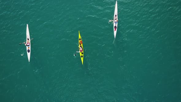 Aerial video of three canoes cruising along Wallensee Lake in Switzerland during Summer (1) alt