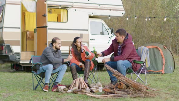 Carefree Friends Making a Toast with Beer alt