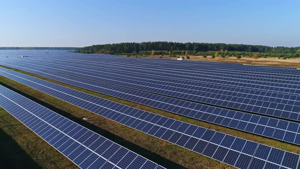 Aerial Drone Footage. Low Flight Over Solar Panel Farm. Renewable Green Alternative Energy