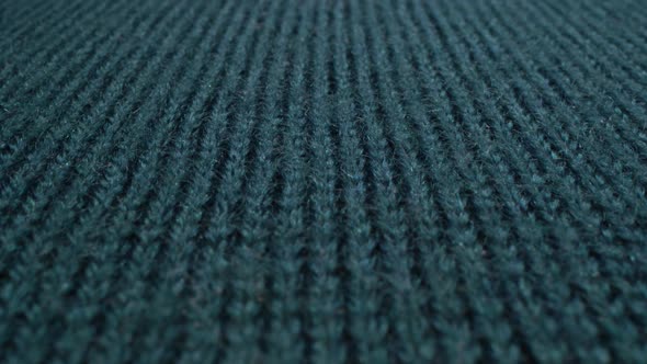 Cozy sheep wool tidewater color fabric texture in macro. Teal handcraft knitting woolen sweater alt
