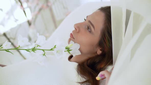 Young Beautiful Girl in White Decor alt