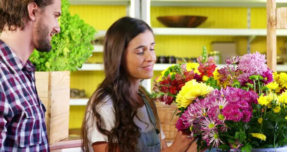 Couple selecting a flower bouquet alt
