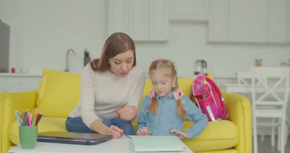Mother and Daughter Doing Difficult Homework alt