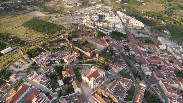Silves Cathedral, Algarve. Aerial cityscape view of medieval walled Silves city. alt
