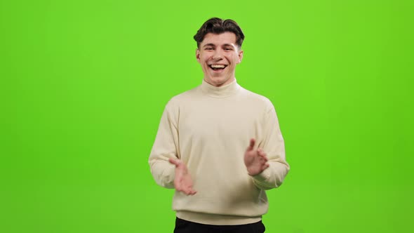 The Man is Standing and Looking at the Camera alt