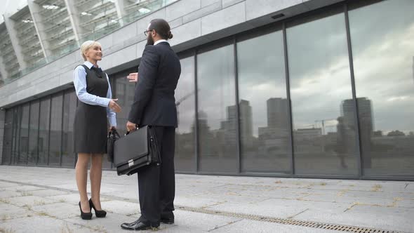 Man and Woman Shaking Hands and Smiling, Business Partners Getting Acquainted