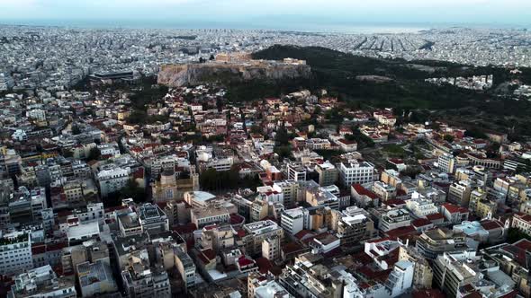 Drone View of the Acropolis of Athens Surrounded By Streets Before Sunrise