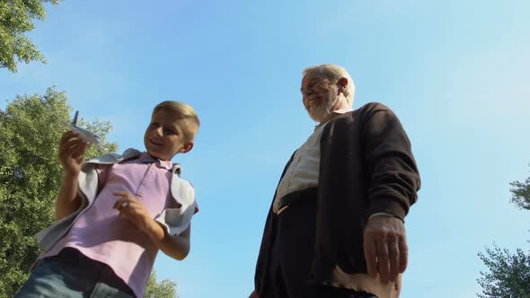Grandfather Gives Toy Airplane to His Grandson, Boy Dreams of Becoming Pilot alt