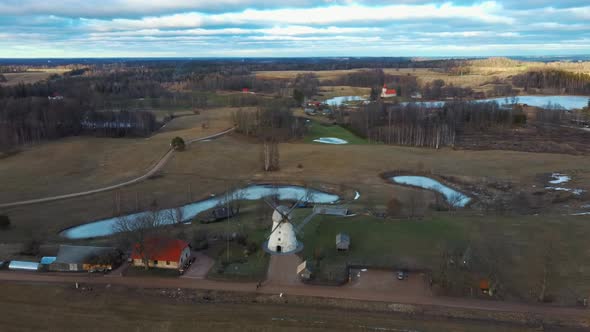 Old Araisi Windmill in Latvia Aerial Shot From Above. Winter Day at Sunrise 4K Video alt