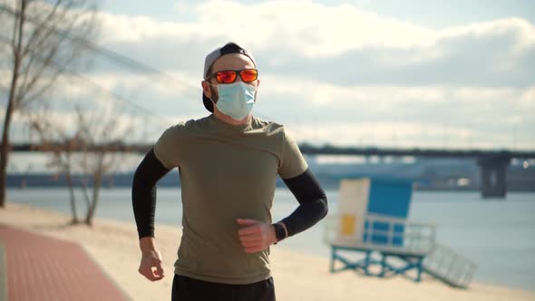 Runner In Face Mask Workout Outdoors.Coronavirus Lockdown Self Distance Activity.Fitness Running alt