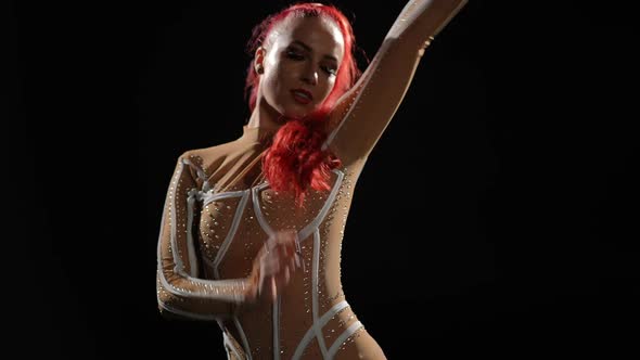 Back View Slim Young Woman Turning Looking at Camera Performing at Black Background alt
