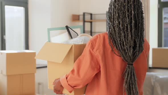 Woman with Box Moving to New Home