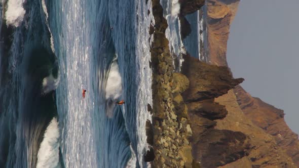 A person surfing the wave at the Benijo beach, Tenerife, Handheld alt