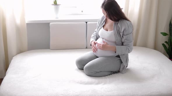 Pregnancy Motherhood People Expectation Concept Happy Pregnant Woman Touching Her Tummy in Bed at alt
