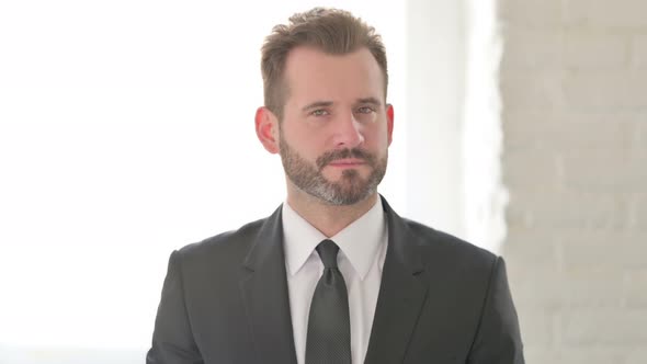 Middle Aged Businessman Showing No Sign By Finger Denial alt