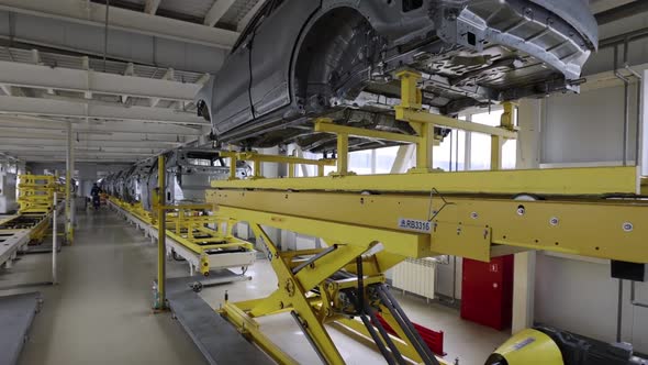the Car Body Moves Along the Conveyor to the Painting Area a Modern Vehicle Manufacturing Plant