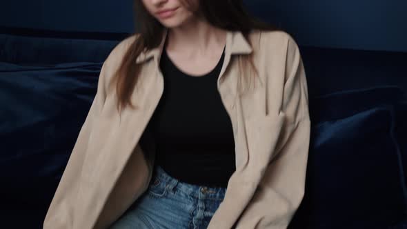 Attractive Young Caucasian Woman Use Phone Social Media Platform and Sit at Home. Stay at Home Relax alt