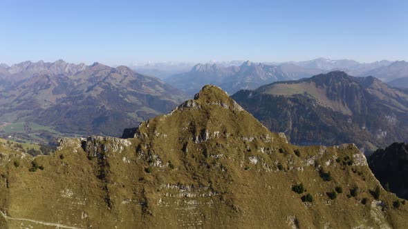 Aerial orbit of prealpine summit "La Cape au Moine", Vaud - SwitzerlandAutumn colors and the Alps i alt