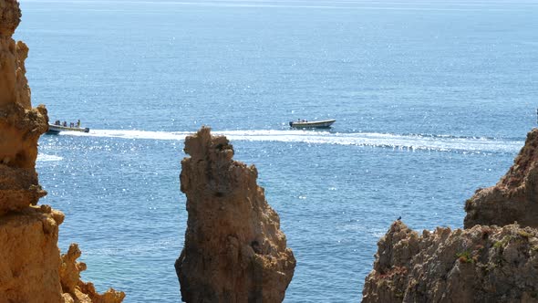 Touristic Motorboats Sailing in Atlantic Ocean by Ponte de Piedade, Portugal, Lagos, Algarve Region alt