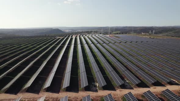 Aerial orbiting over Solar panel rows on electric production Park, Lagos. Algarve