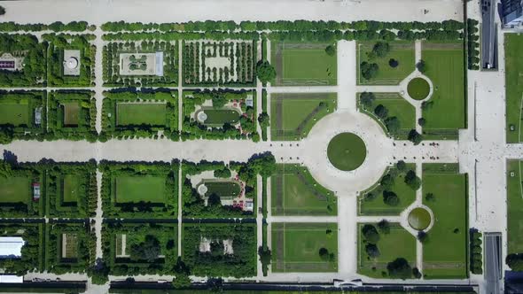 AERIAL: Top Down Overhead View of Paris Tuileries Garden in Summer with Rich Green Colors alt