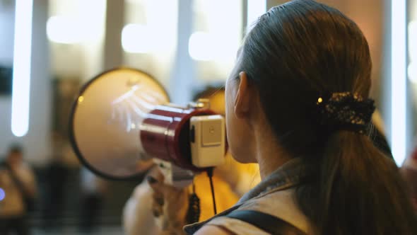 Civil Rights Feminist Activist Speaker with Bullhorn on Picket Strike Protest alt