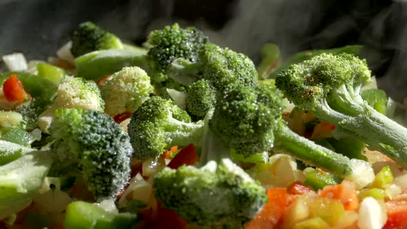 Lunch of Vegetables. Cook the Vegetable Stew in a Pan. Frozen Vegetables on a Salad. Semi-finished