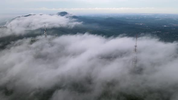 Mmorning fog cloud fast move at telecommunication tower alt
