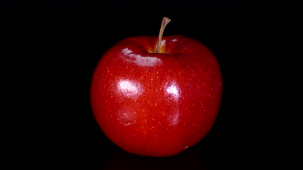 Ripe Red Apples on a Black Background