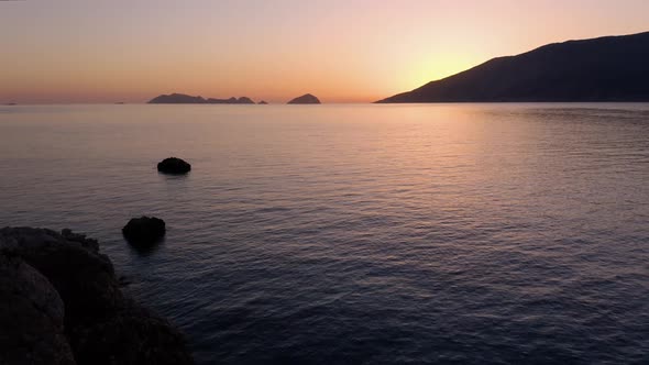 Aerial Panoramic View of Sea Gulf and Mountains at Sunset alt