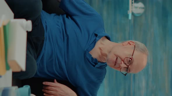 Vertical Video Married People Watching Movie on Television in Living Room alt