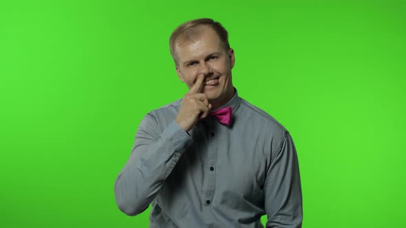 Funny Stupid Man Picking Nose. Silly Brainless Humorous Expression, Removing Boogers, Bad Manners alt