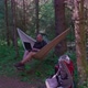 Man with laptop relaxing in hammock and networking in the country - VideoHive Item for Sale