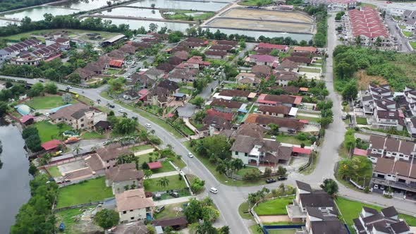 Drone flying around Venice of Perak, featuring wide array of residential buildings in the neighborho alt