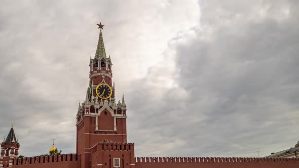Moscow Kremlin, Red Square. Spasskaya Saviors clock tower in front of storm cloudy sky.