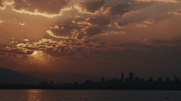 Time lapse of Sunrise over Vancouver Skyline Silhouette with beautiful clouds alt