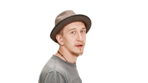 Scared Young Handsome Man Running Away Over White Background alt