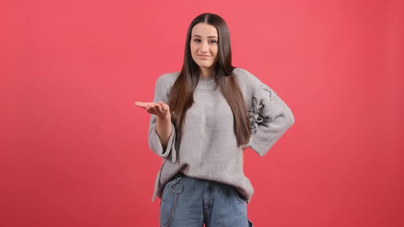 Woman Isolated Over Red Background Unhappy for Not Understand Something alt