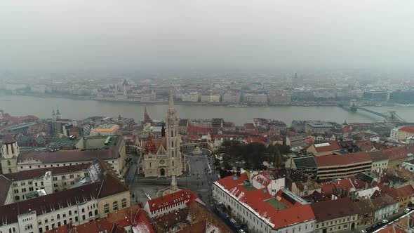 Aerial view of the ancient European city of Budapest on a foggy day with sights in Hungary alt