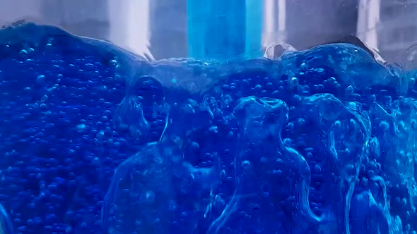 Bubbling blue liquid background video.