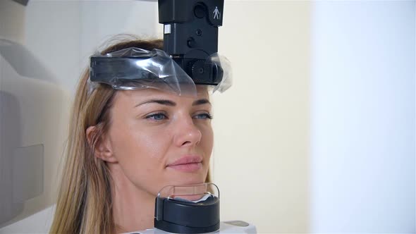 Woman Having Panoramic X-ray Scanning Procedure In Clinic.