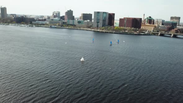 Aerial View Of Sailboats In Charles River With Boston Cityscape From Cambridge, Massachusetts - dron alt
